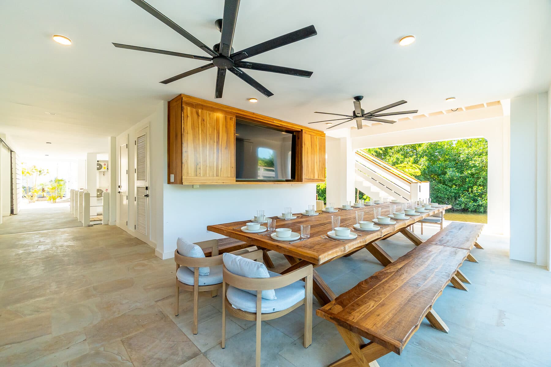 Outdoor dining patio prepared for a group gathering at BelaDia